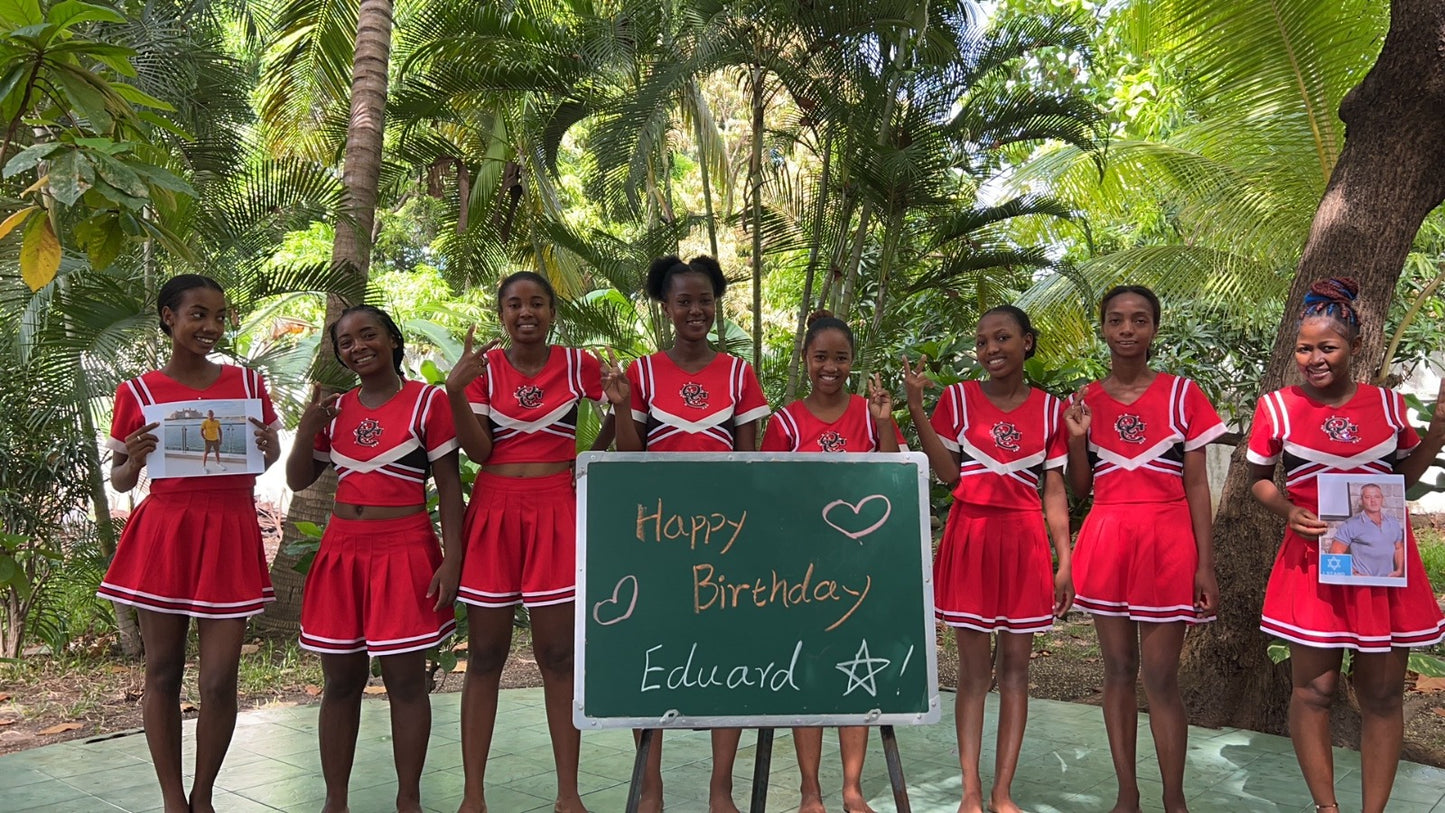 Red Spirit Cheer Crew performing a high-energy cheerleader-style personalized celebration video