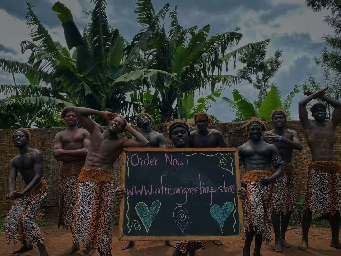 African dance team holding a chalkboard for personalized birthday video greetings and custom messages.