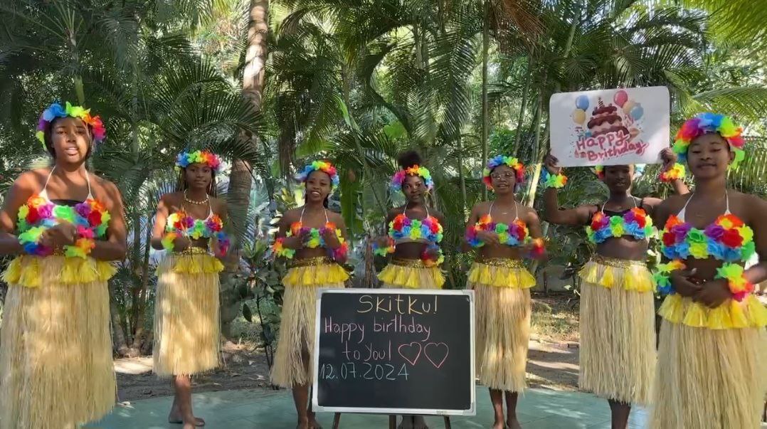 Tropical Joy Crew delivering a colorful personalized celebration video with dancing and tropical costumes from Africa